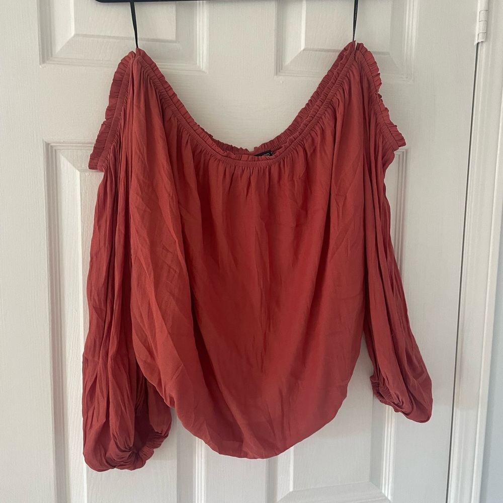 Plus size rust coloured off shoulder top with long sleeves
